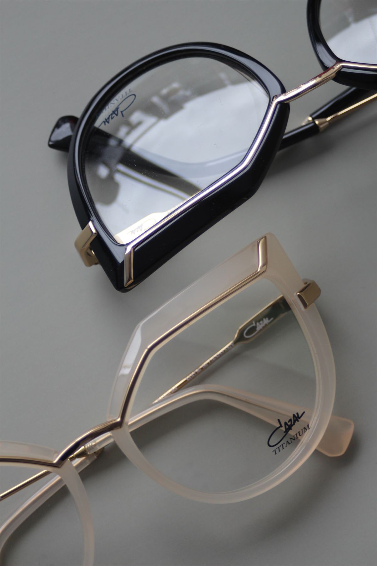 Cazal titanium designer frames in black and gold, stocked by One Optics